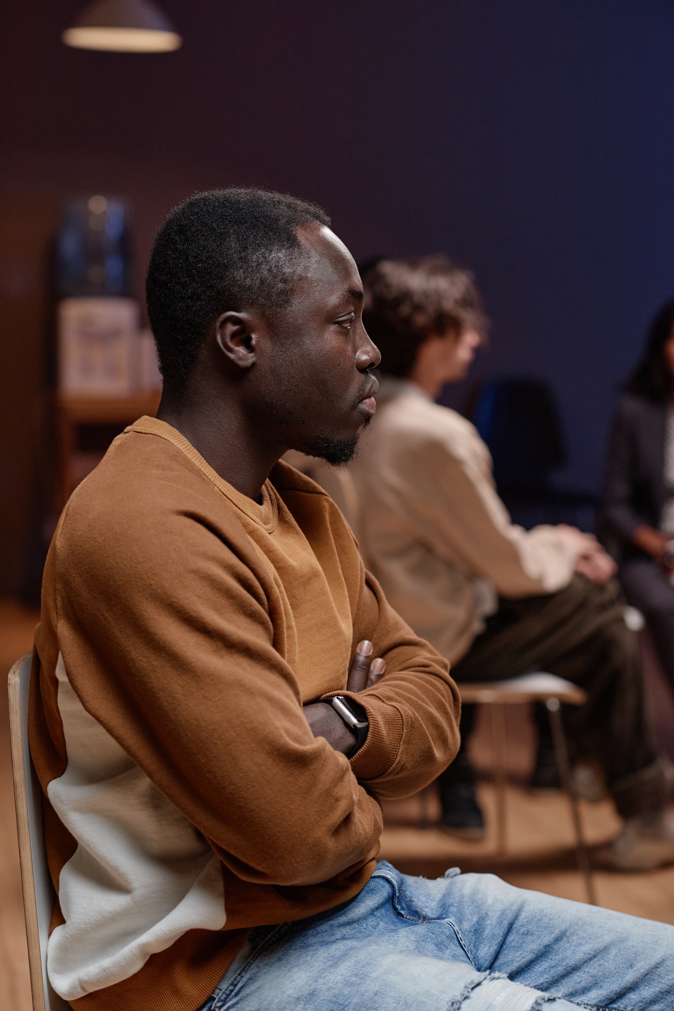 Young Man In Group Therapy Session